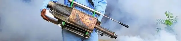 Fumigation technician using a fogger for deep pest treatment in Cape Coral, FL